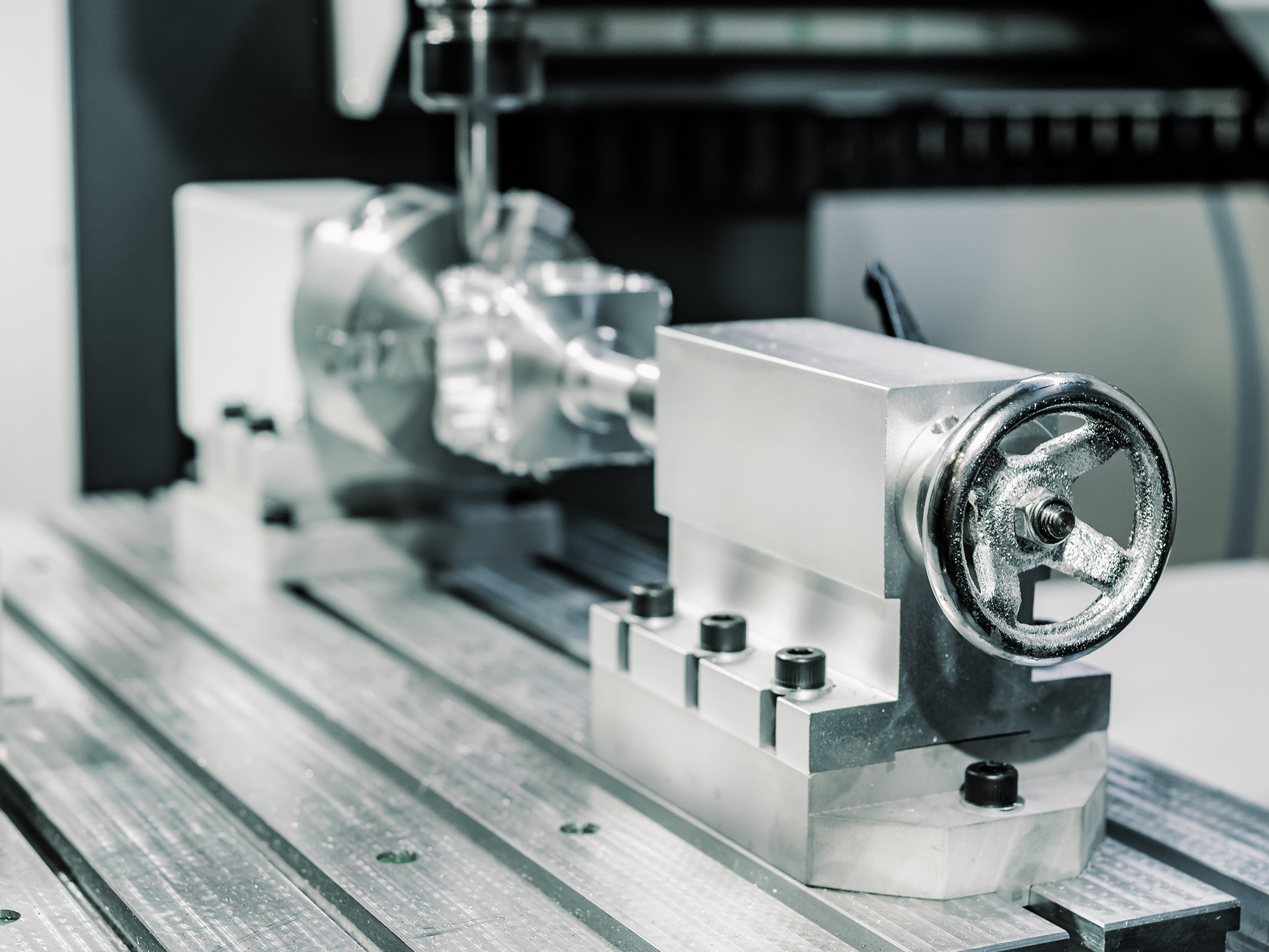 Precision milling CNC machine tool makes part.